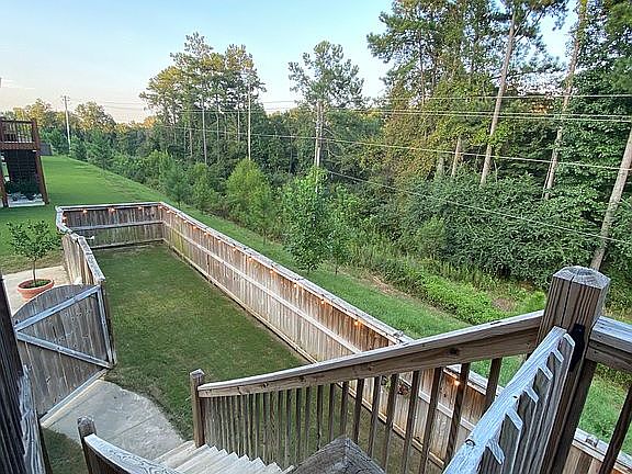 View of backyard from deck. 