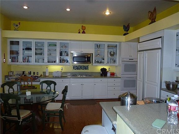 Large country kitchen, nook area, built-in pantry & refrigerator and custom.