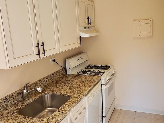 Kitchen with ample cabinets and countertops