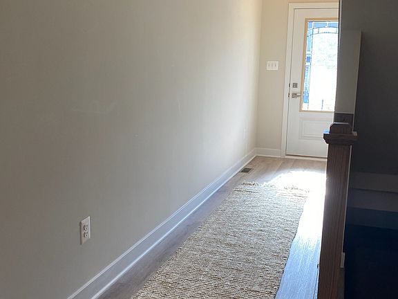 View of front door from dining room