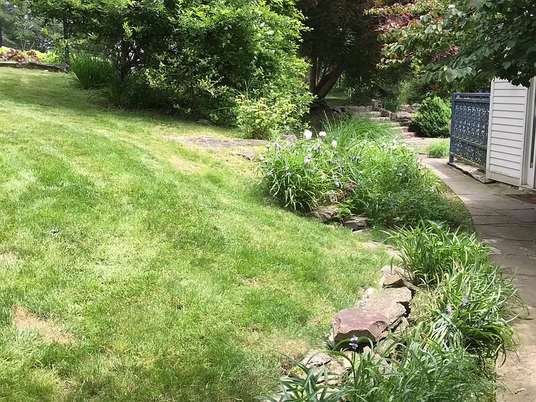 Side entrance, flower and herb gardens