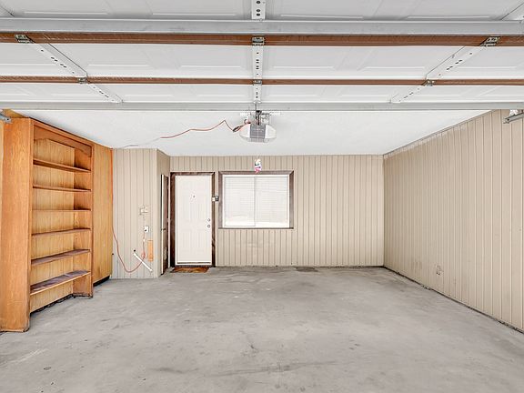spacious two car garage goes directly into the kitchen. Extra storage in a large room inside the garage.