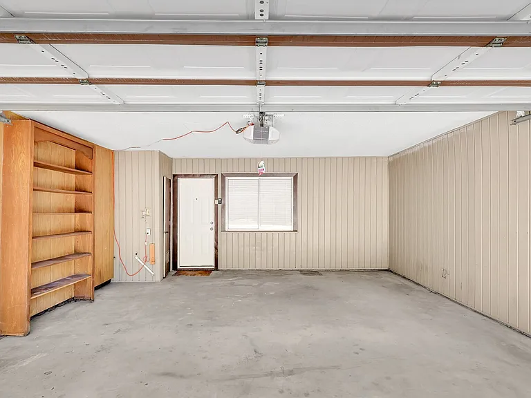 spacious two car garage goes directly into the kitchen. Extra storage in a large room inside the garage.