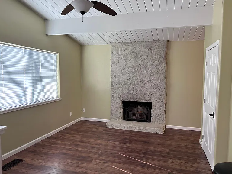 Formal dining / office area (fireplace not operable) door on right is large pantry