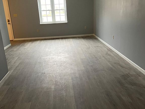 Large great room with luxury vinyl tile