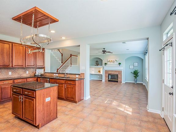 You want OPEN CONCEPT... you got it! Easy flow between the kitchen, breakfast and family rooms. This home is bright, super clean, looks like a new home and lives large.