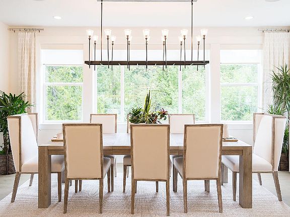 Bright Dining Area Complete with Upscale Lighting Fixture