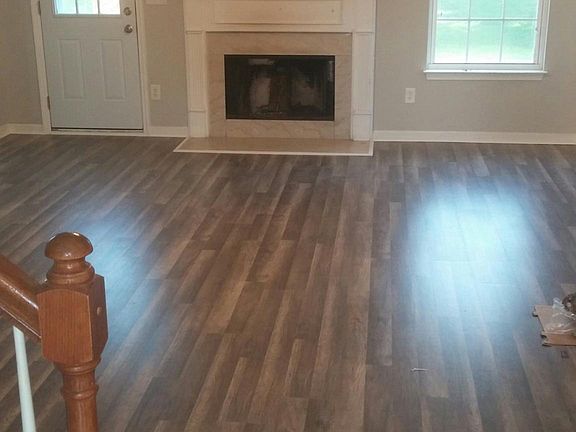 Large living room with fireplace. New paint and flooring