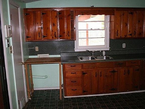 Kitchen with dishwasher, electric stove & refrigerator