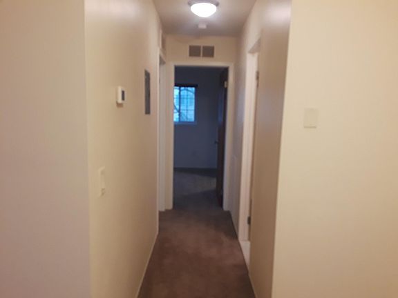 Hallway from kitchen to bedrooms and bathroom.