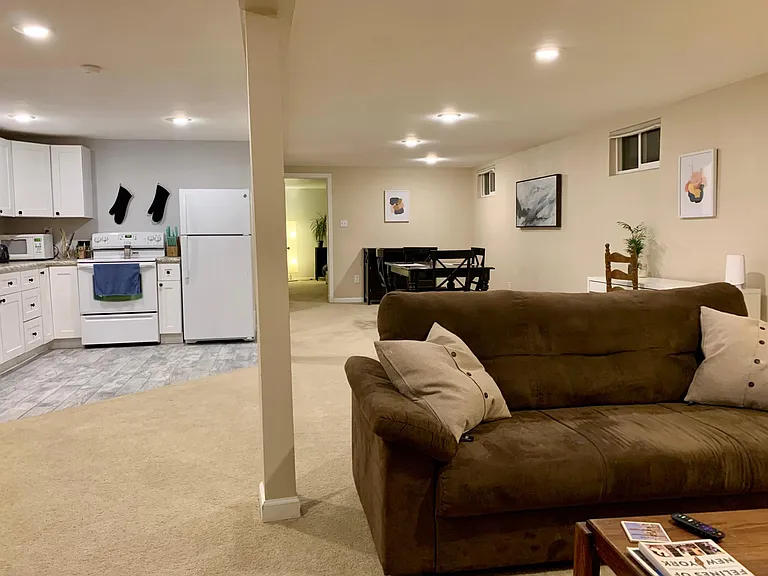 Basement level apartment with open level kitchen/dining/living