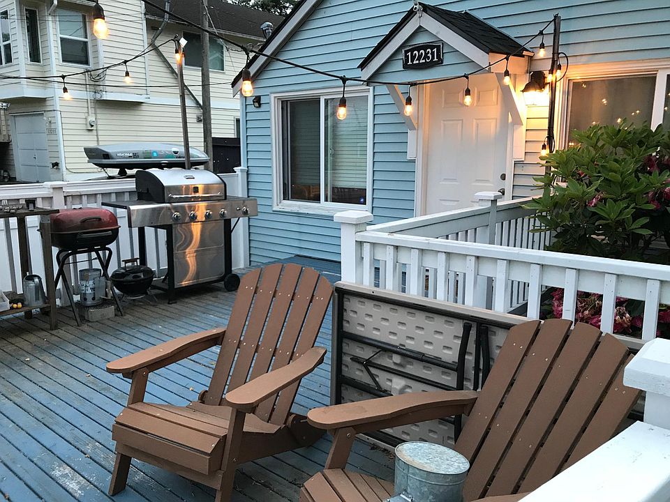 Large deck for entertaining, lined with string lights