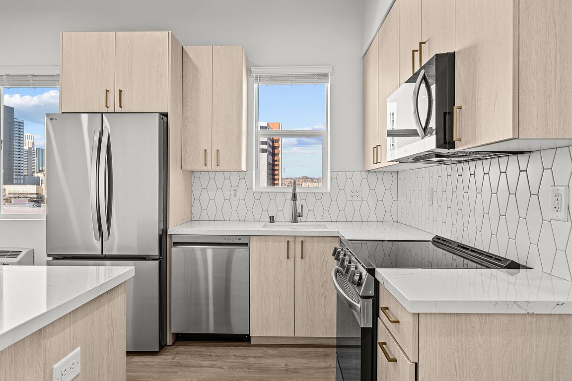 Experience the elegance of a contemporary kitchen, merging style with function.