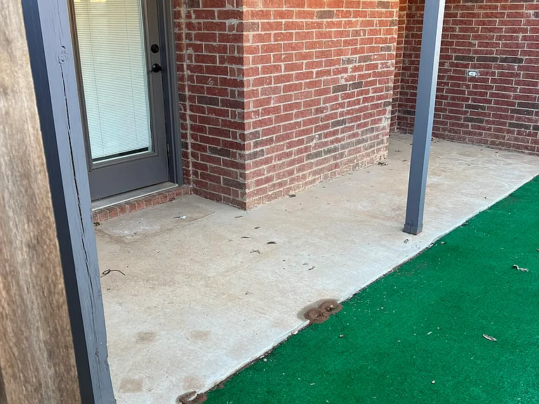 Side Patio with Astroturf yard area
