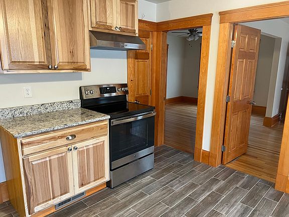 Pantry next to stove as well as doors to living room/bedroom #2