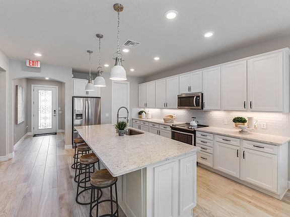 The Fox Hollow offers a large kitchen with center island.