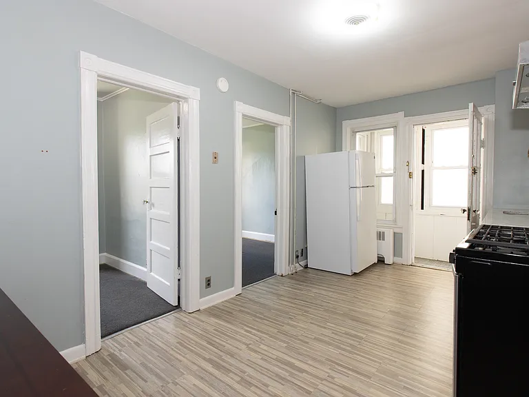 Kitchen showing two bedrooms