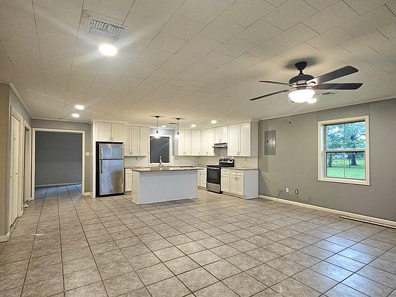 Living/Kitchen with extra room off kitchen that can be used as an additional living area or playroom
