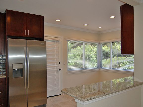 Sunny Artsy Eating Area in Kitchen with Lots of Lighting
