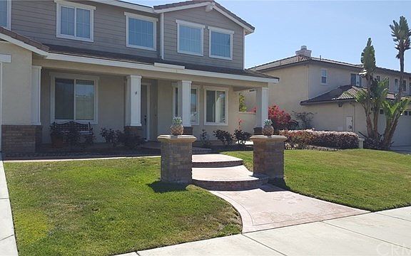 Lush Landscaped yard, Porch Area in front of Home