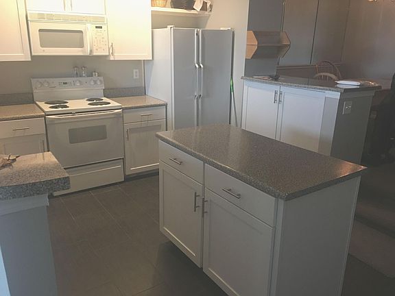 Kitchen with new cabinets and tile floors