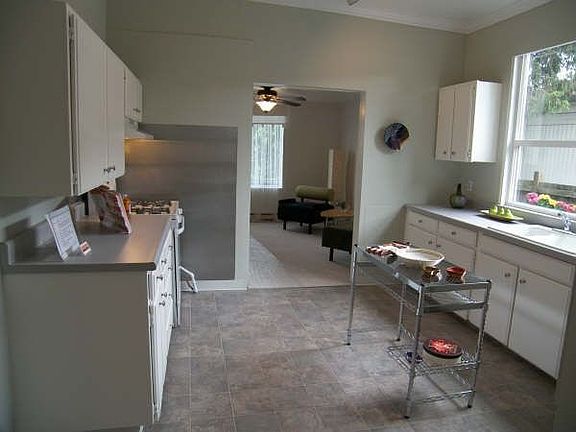 Kitchen from hallway to third bedroom