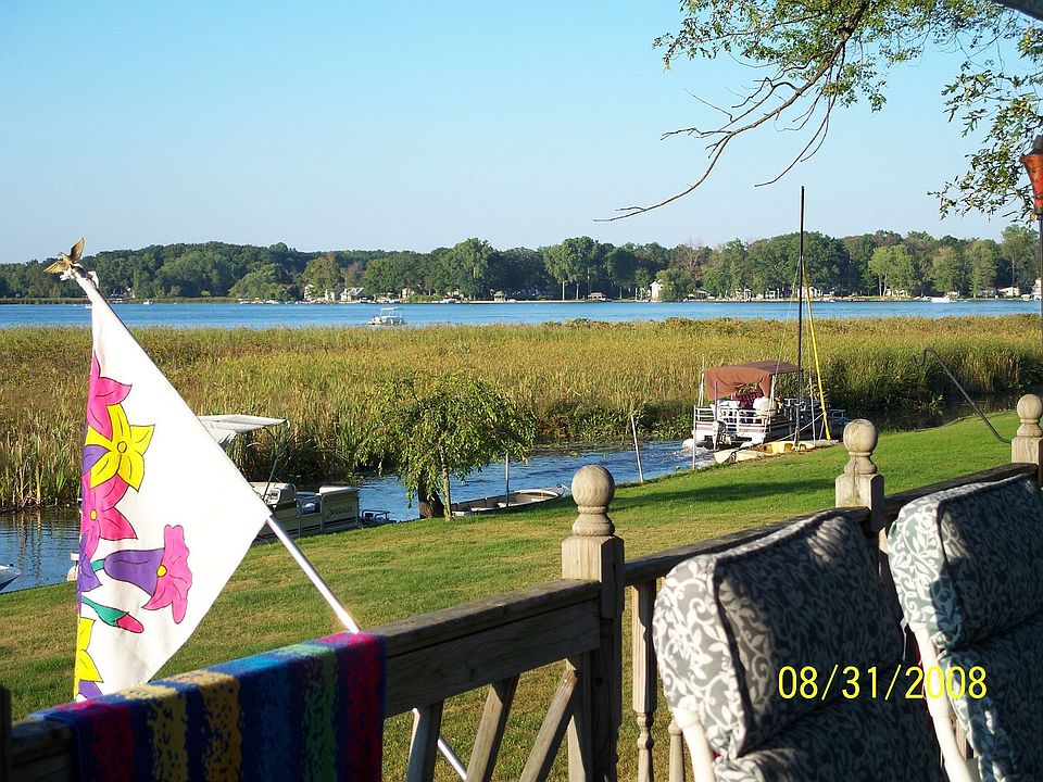View of lake from backyard and deck
