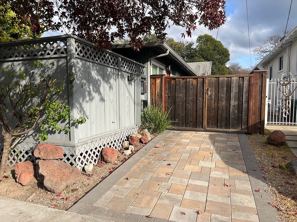 Driveway and gate to 5154 Shafter Ave. Unit A deck is the grey fence to the left.