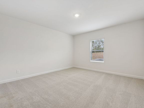 Design a private space for guests in the basement-level secondary bedroom.