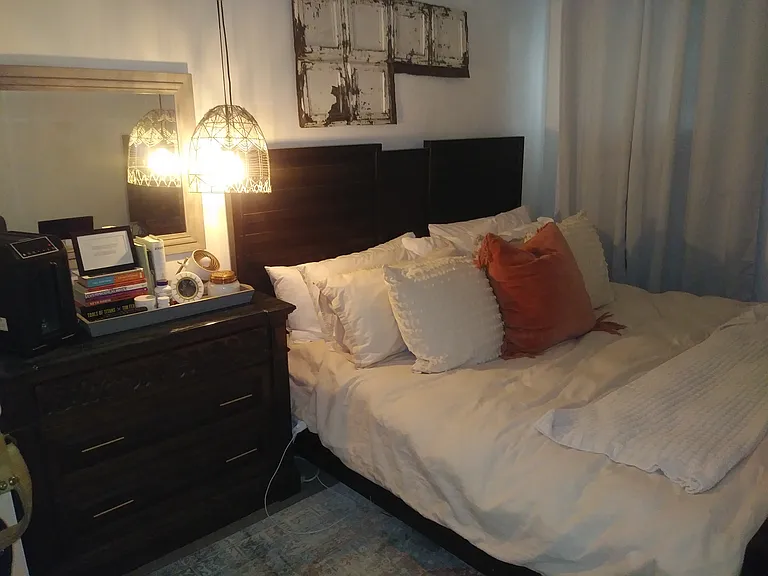 Bedroom accessorized by previous tenant.