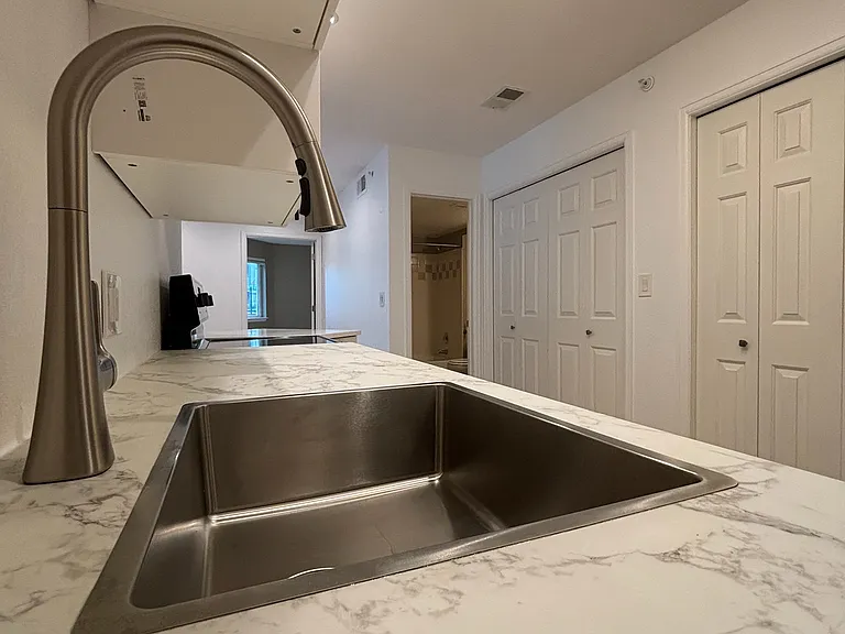 newly remodeled kitchen - view of laundry closet, second bathroom