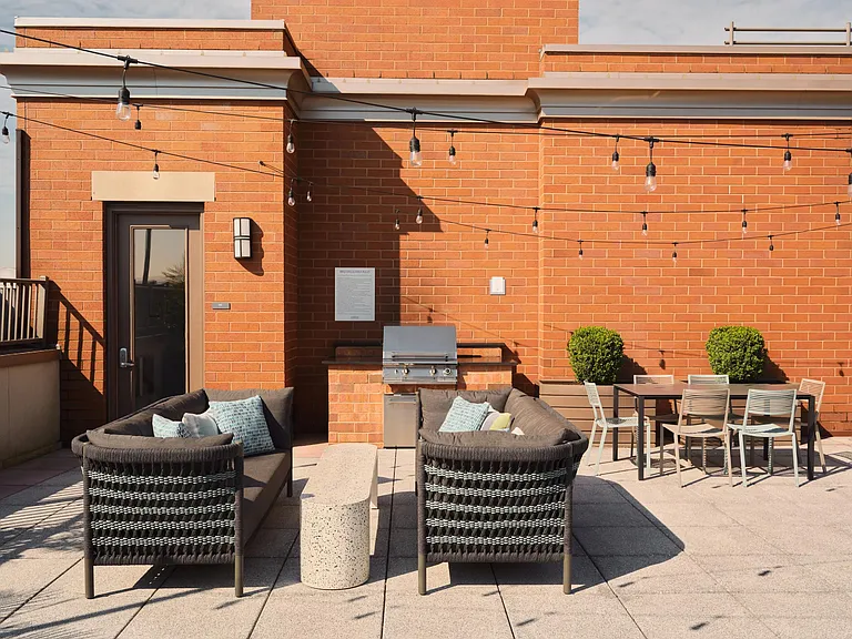 Dine al fresco with outdoor seating on the rooftop terrace.