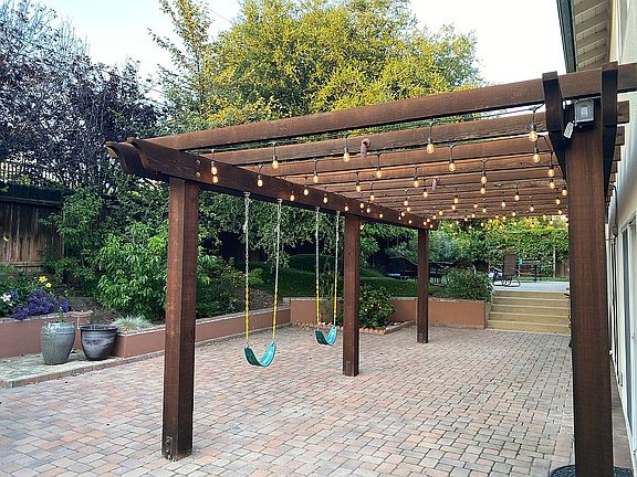 Pergola swings fruit trees