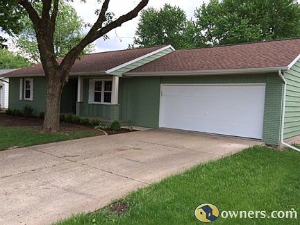 Mature trees with new landscaping.