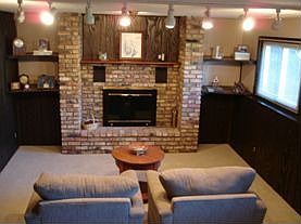 Walk-out family room with fireplace for cozy winter nights.