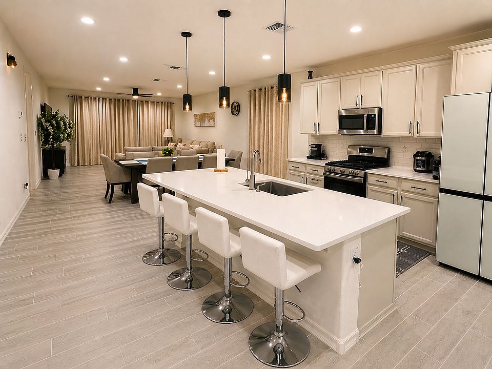 Bright open-concept kitchen and living area with large island