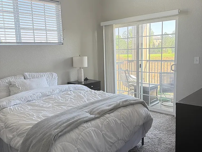 Master Bedroom with private balcony overlooking golf course