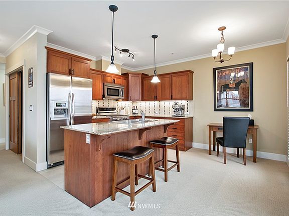 Second view of kitchen with countertop seating.