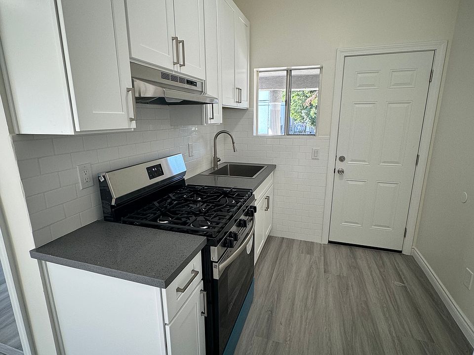 Kitchen area leading to the balcony.