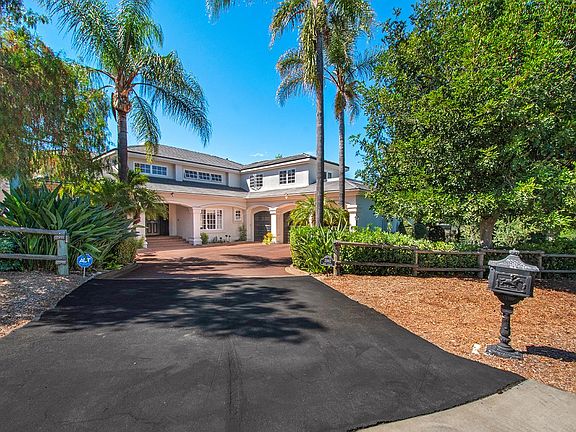 Long driveway with three car garage