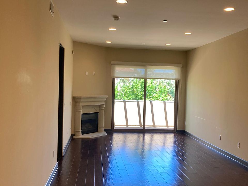 Gas fireplace, wood floors, roller shades, dimmable lights.