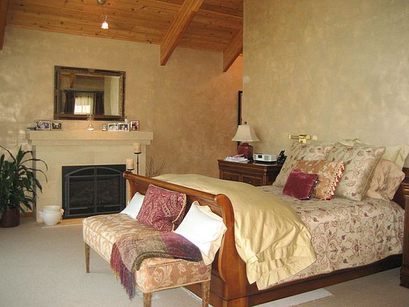 Master bedroom - has wall of windows overlooking lake