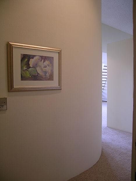 Spacious entry with curved wall