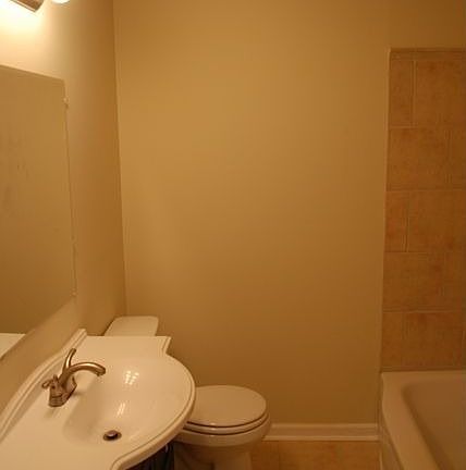 Renovated bathroom new tile and vanity.