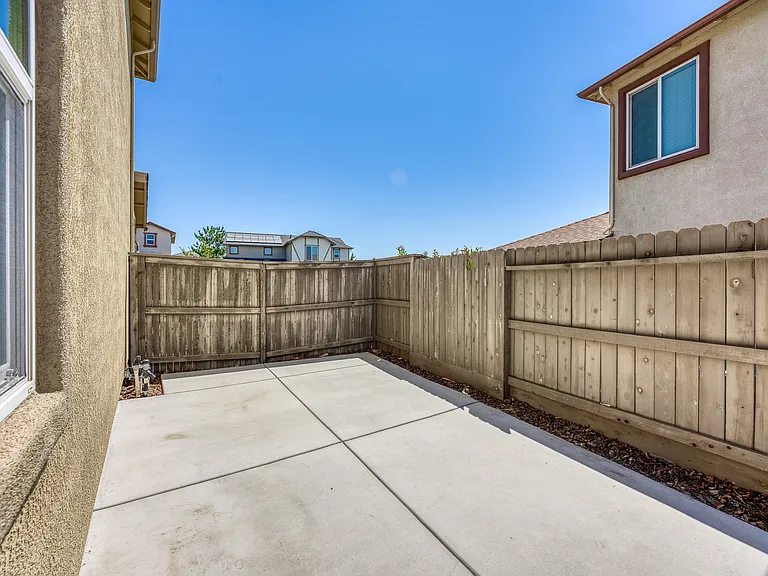 Concrete side backyard .