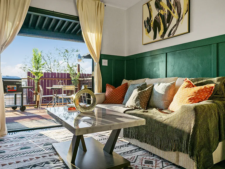 Spacious living room with easy access to a relaxing balcony.