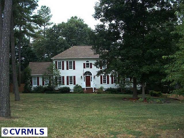 Front yard  .59 acres, new roof and paint, professional landscaping