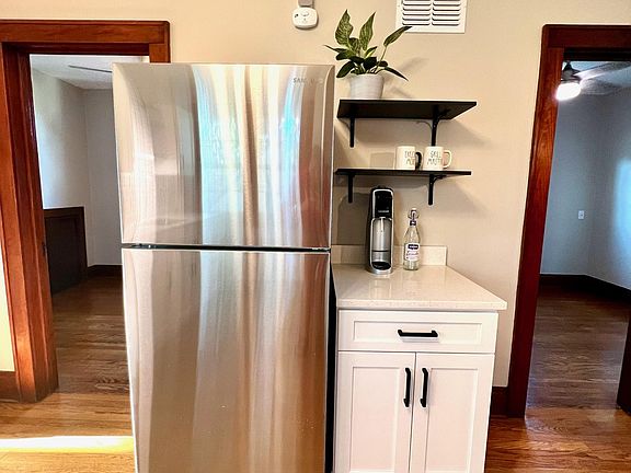 Brand new stainless steel fridge with a potential coffee station!