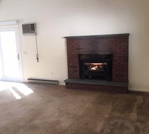 fireplace in living room/sliding door