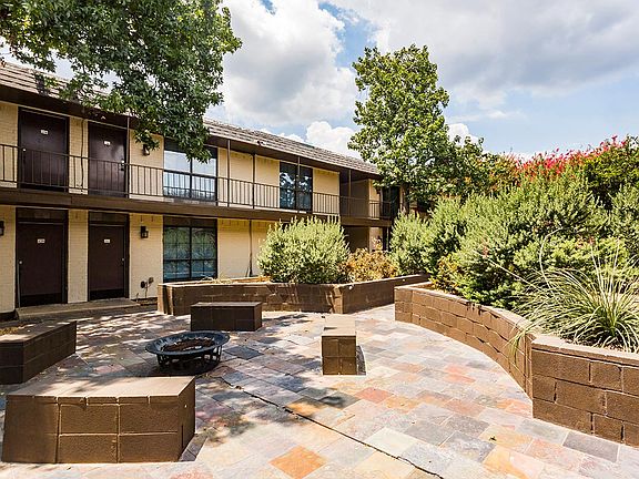 LaVita on Lovers Lane exterior building, outdoor fire pit, and patio seating area